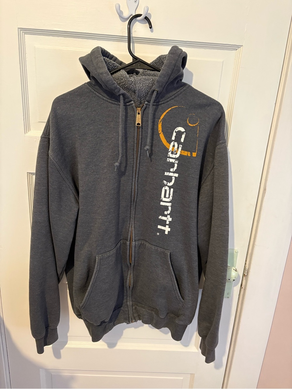 Carhartt Y2K Charcoal Gray Zip-Up Hoodie with Vertical Logo and Orange Accent.